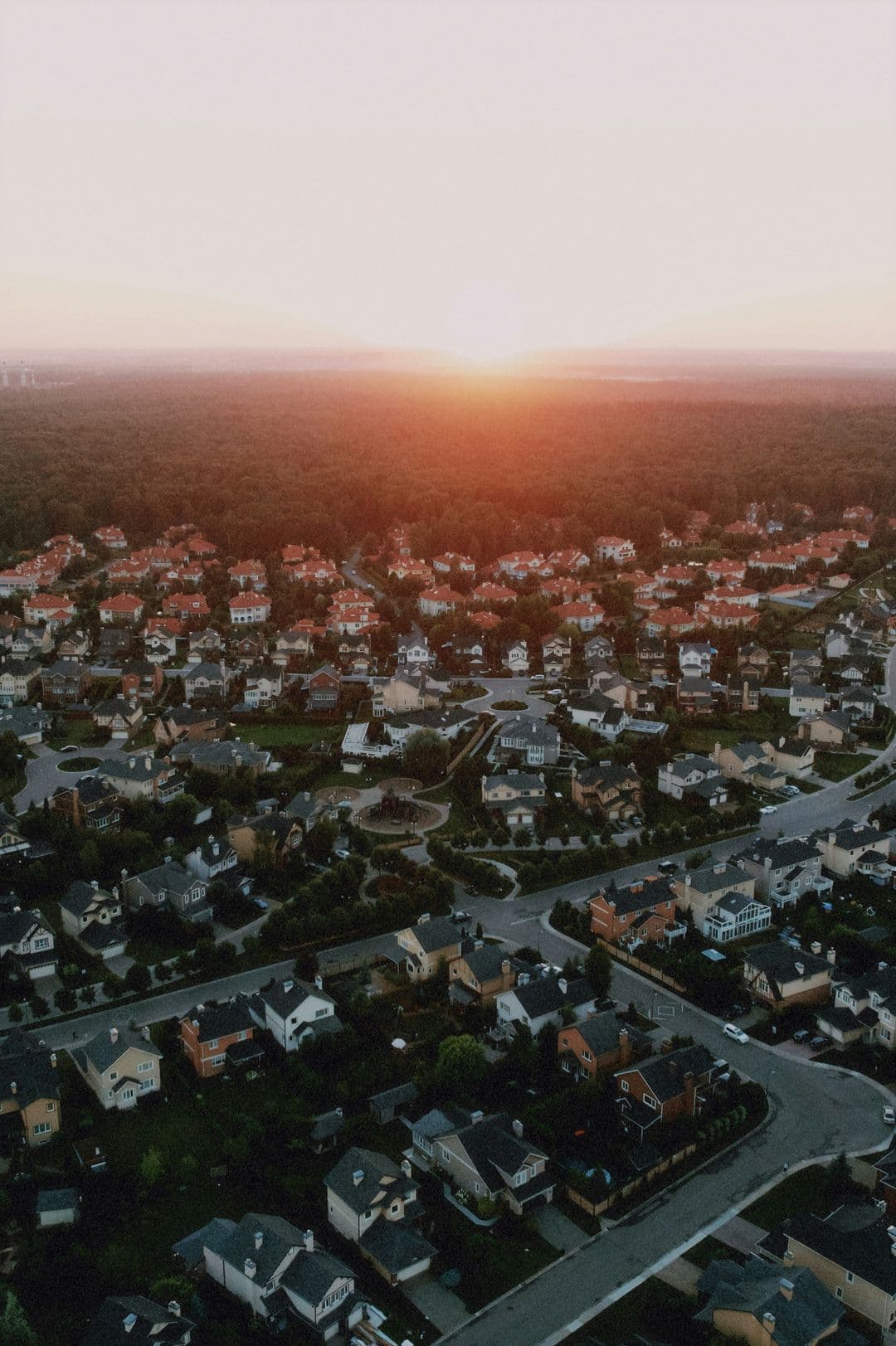 Aerial view of a residential neighborhood at sunset